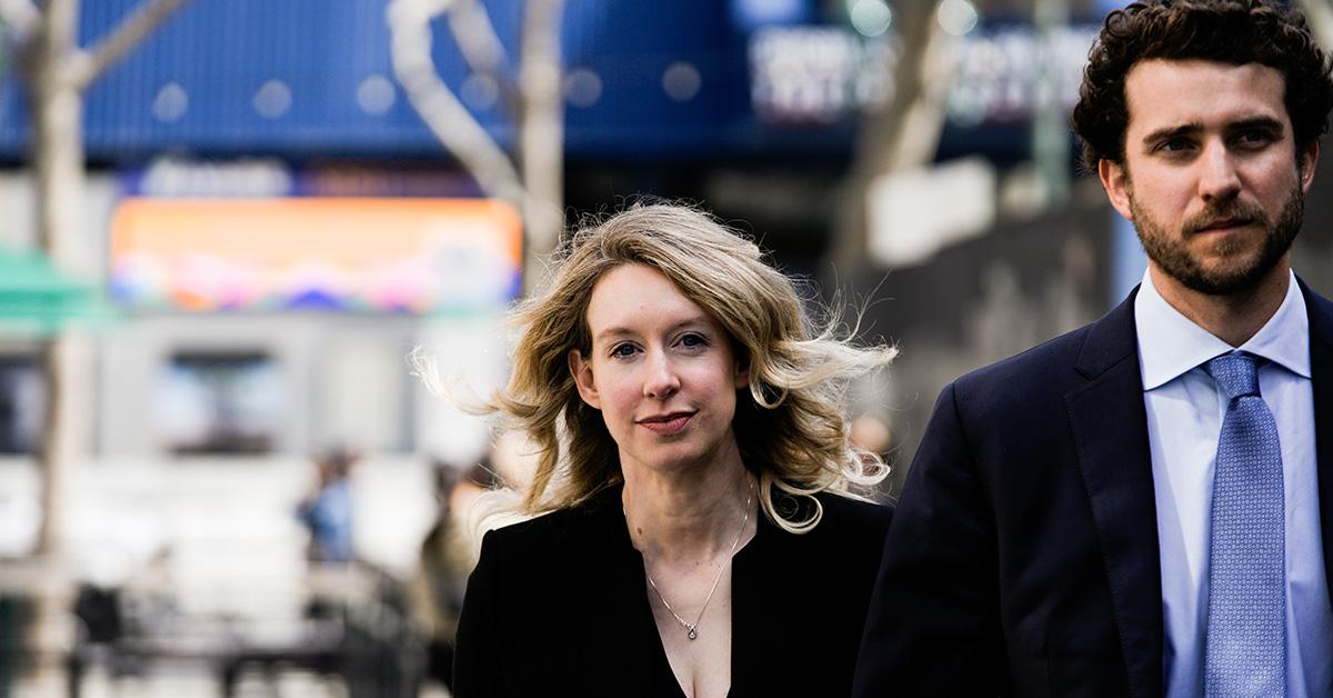 Elizabeth Holmes and her husband at a March 2023 restitution trial. 