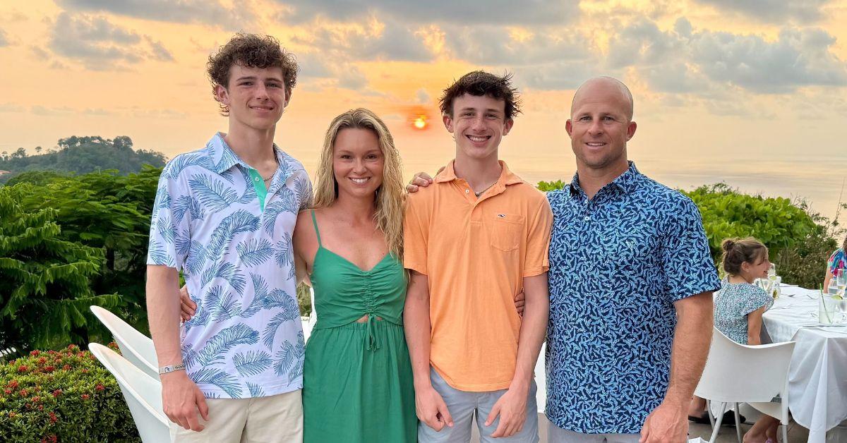 The Gardner family with a sunset behind them. 