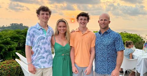 The Gardner family with a sunset behind them.