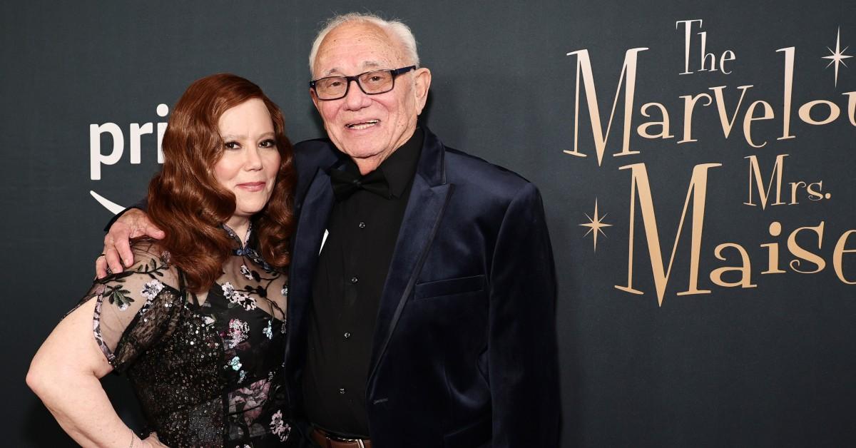 Alex Borstein (L), in a black dress, poses with her father, Irv Borstein (R) in a black tux, at the 'Marvelous Mrs. Miasel' Seaosn 5 premiere in NYC