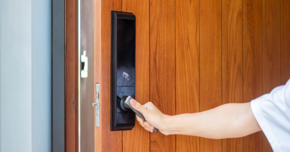 A man holding a door handle