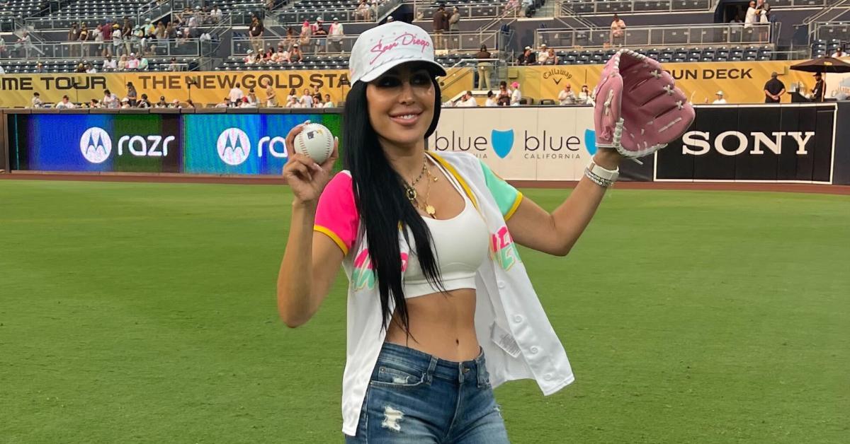 Durana Elmi on the field preparing to throw the first pitch.