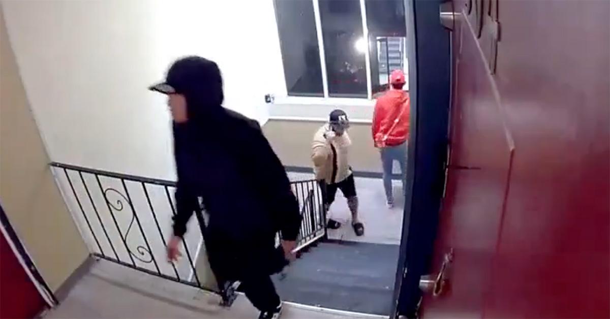 Several men with guns climbing the stairs in Colorado. 