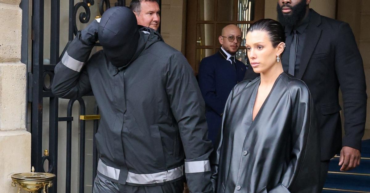 Bianca Censori walking out of a hotel with Kanye West in February 2024.