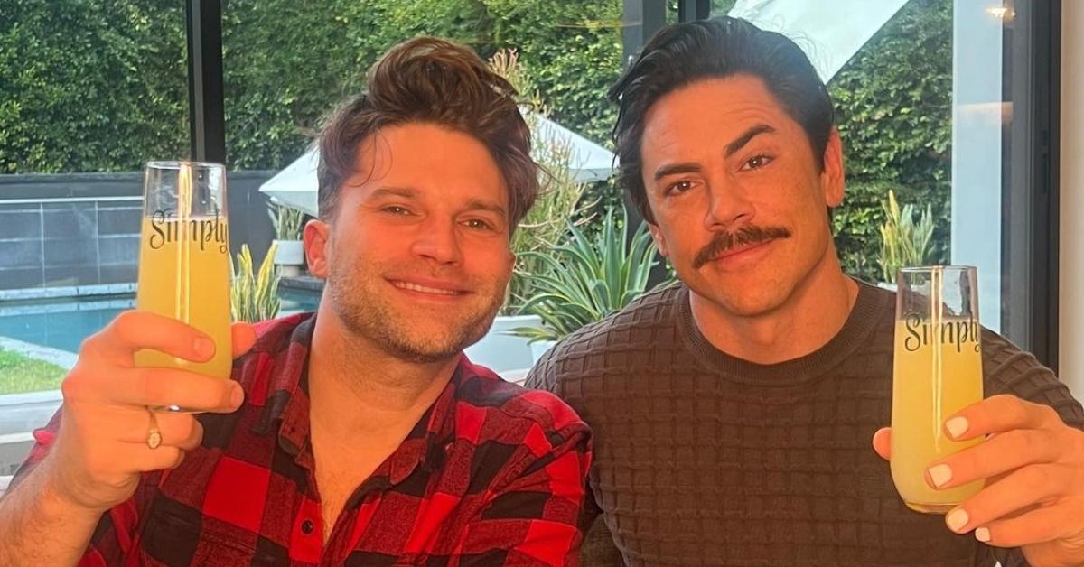 Tom Schwartz and Tom Sandoval hold up drinks in Tom Sandoval's house