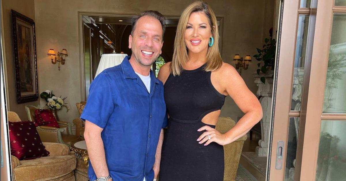 A happy Emily and Shane Simpson inside a home.