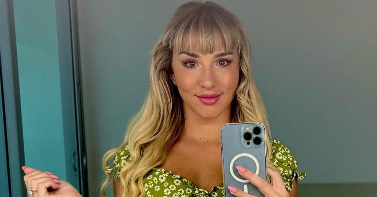 Mikhaila Peterson taking a selfie wearing a floral green top.