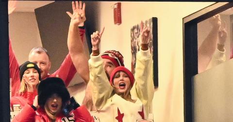 Taylor Swift wearing a white jacket at a chiefs game