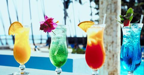 a yellow, green, orange, and blue cocktail