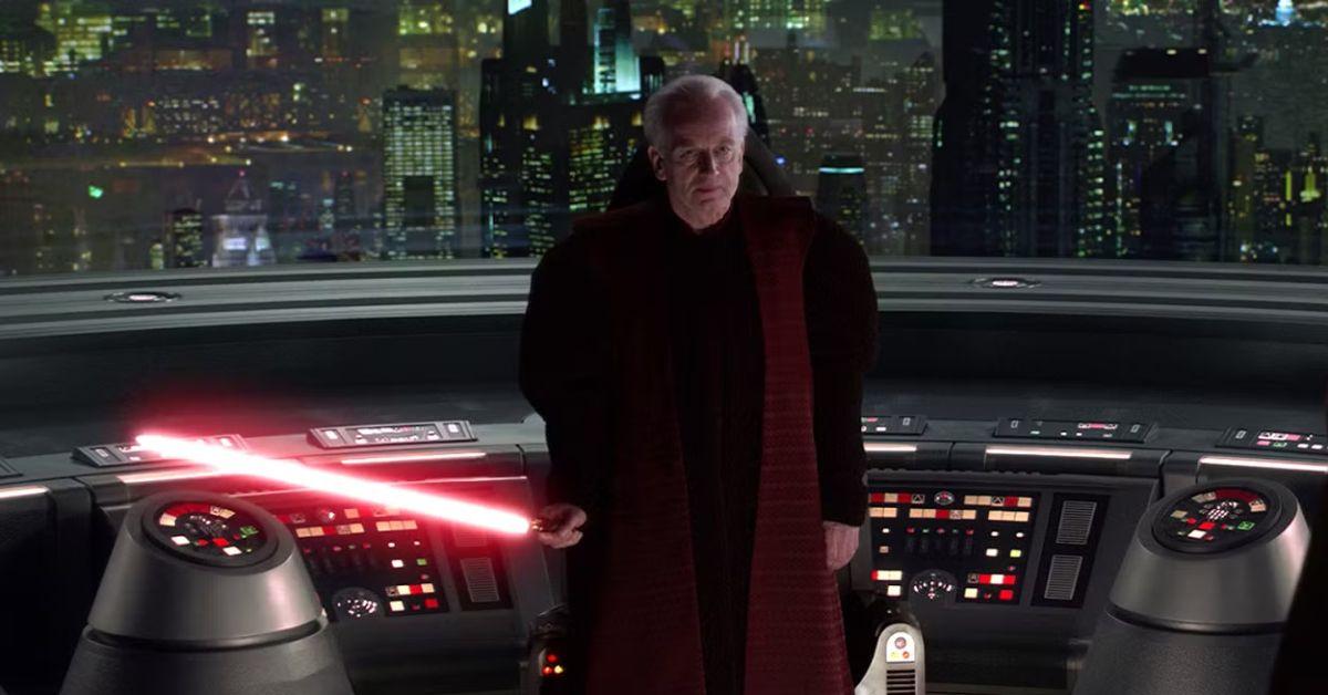 Ian McDiarmid holding a red lightsaber as Emperor Palpatine.