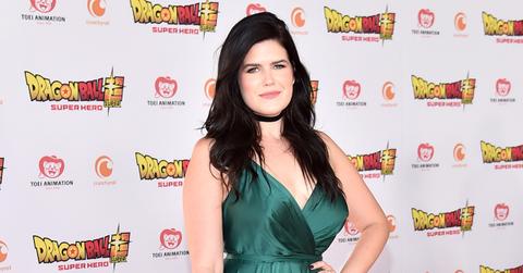 Erica Lindbeck on the red carpet in a green dress.