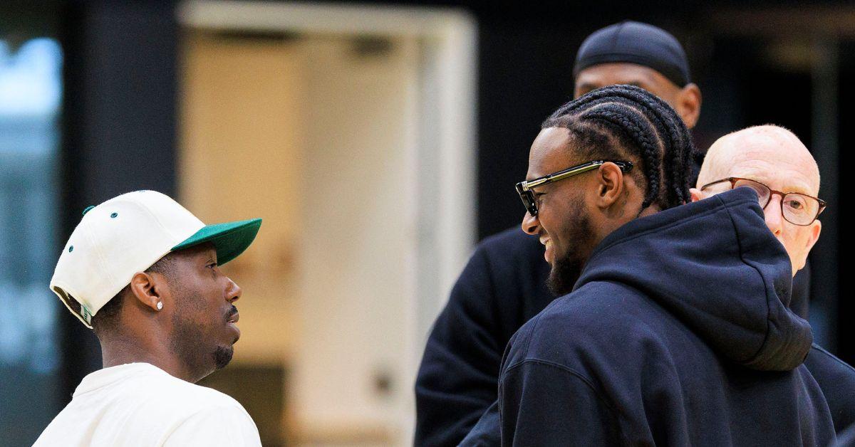 Bronny James talking with his trainer Rich Paul. 