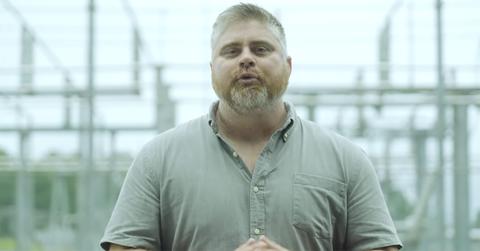 Ben Armstrong talking in a button down shirt.