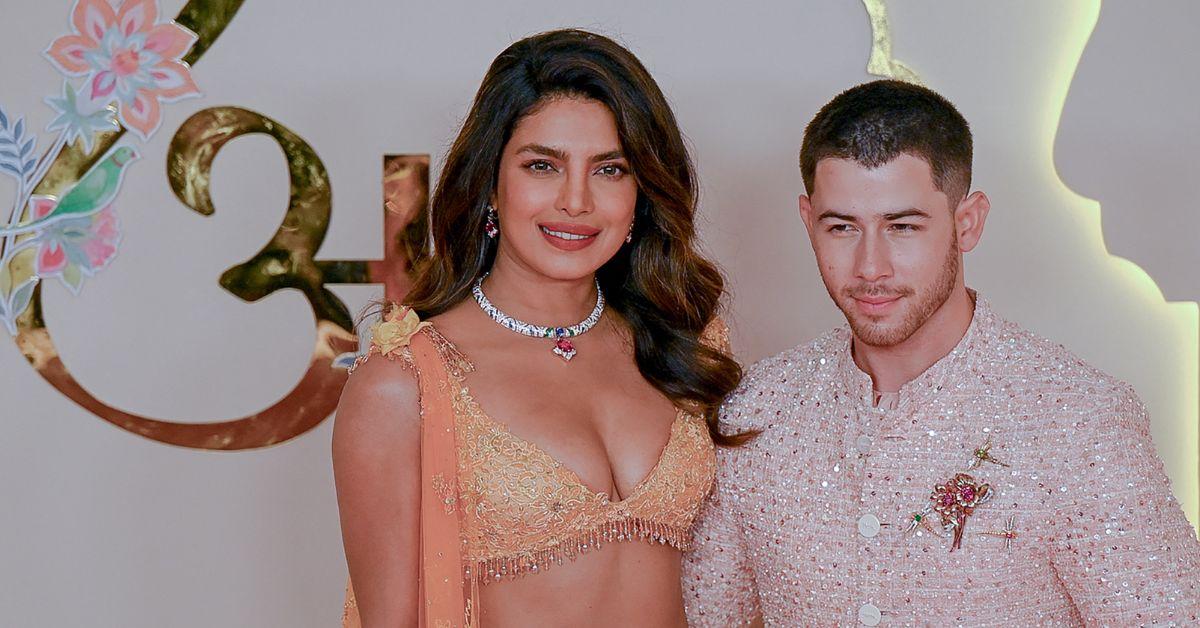 Priyanka Chopra Jonas Nick Jonas ) pose for photos as they arrive to attend the wedding ceremony of Anant Ambani and Radhika Merchant