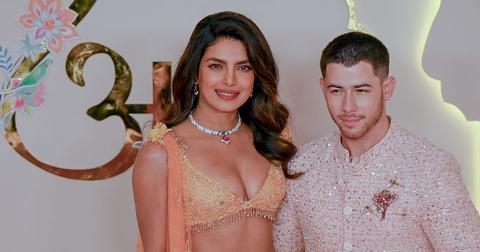 Priyanka Chopra Jonas Nick Jonas ) pose for photos as they arrive to attend the wedding ceremony of Anant Ambani and Radhika Merchant