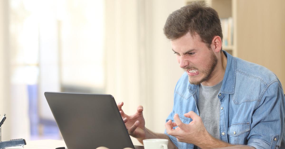 entrepreneur angry and furious with laptop picture id