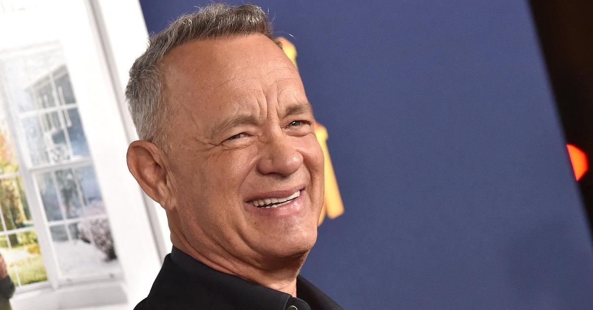 Tom Hanks smiles for a photo