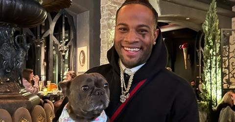 Oliver Saunders from 'Vanderpump Rules' poses with a dog for an Instagram photo