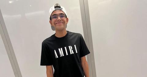 N3on smiling and wearing a black t-shirt