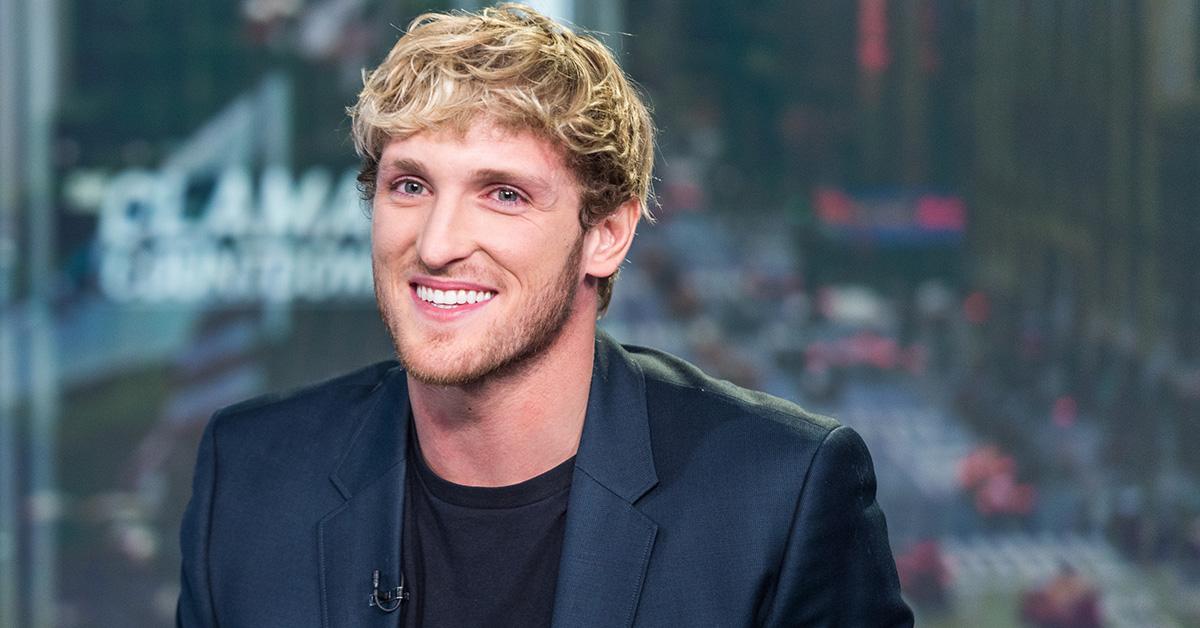 Logan Paul smiling in a blazer in 2019.