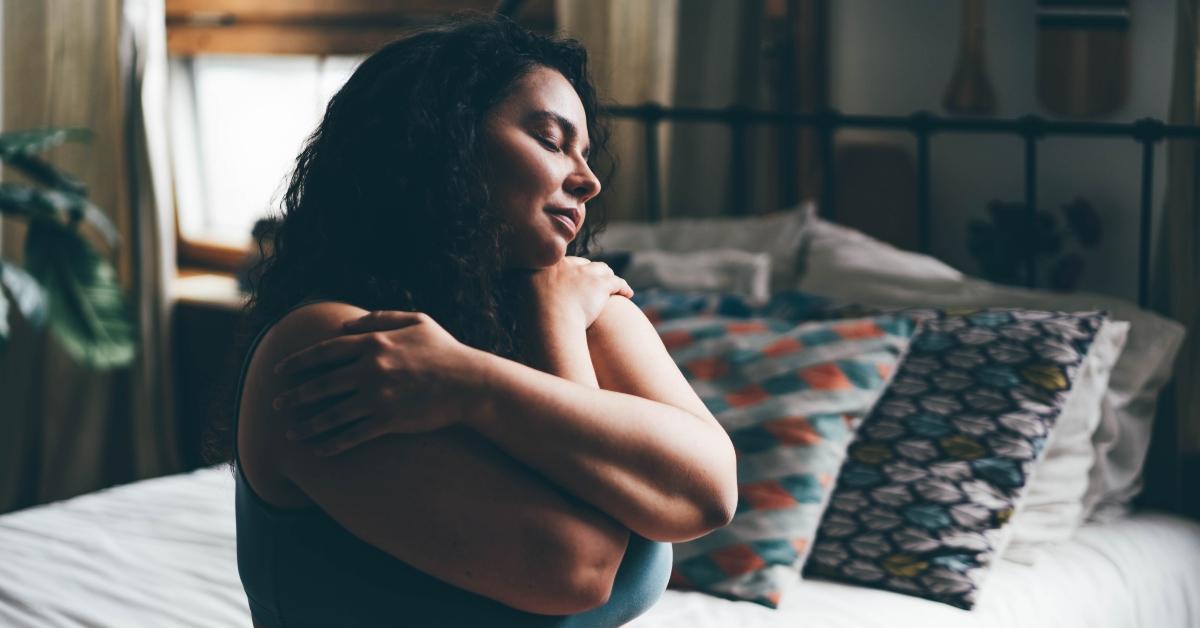 woman hugging herself