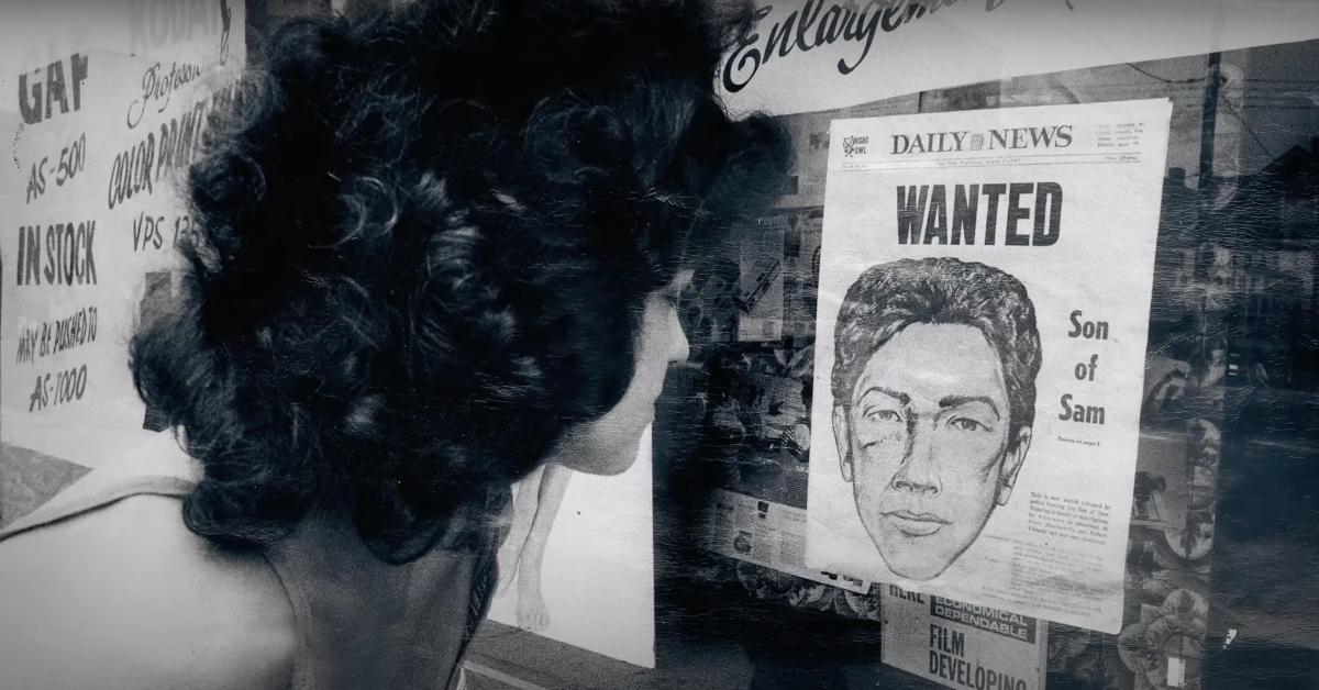 A woman looks at a Son of Sam wanted article in the 'NY Daily News'