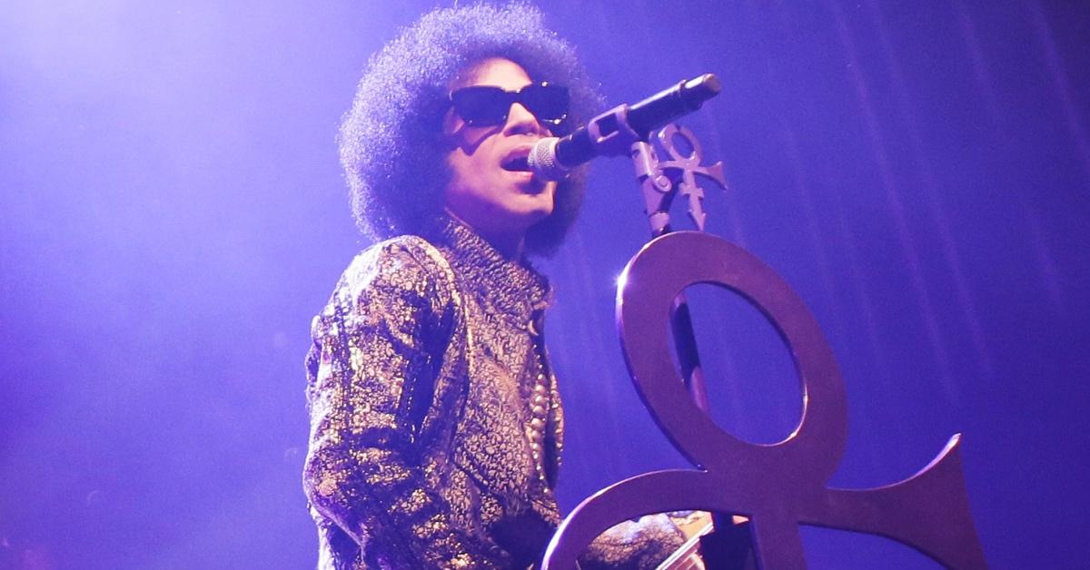 Prince performs with the Love Symbol attached to his microphone stand, 2015.