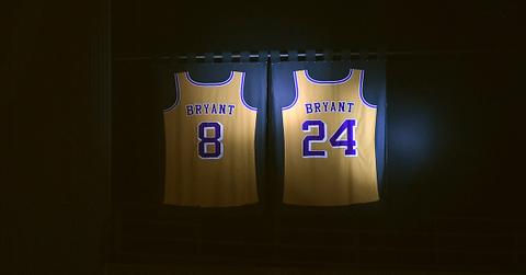 Kobe Bryant's jerseys hanging in the rafters at Crypto.com Arena.