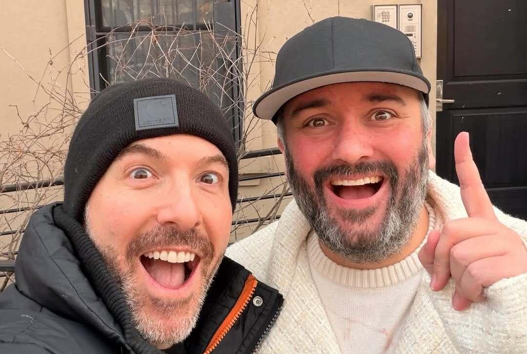 Adam Roth (L) and James Barker (R) in a picture posted after the acquisition of their house. 