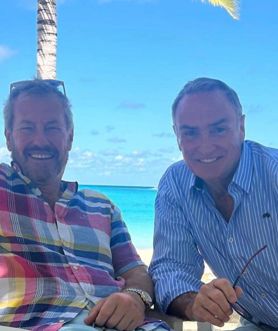 Lord Ivar Mountbatten and his husband, James Coyle, by the beach.