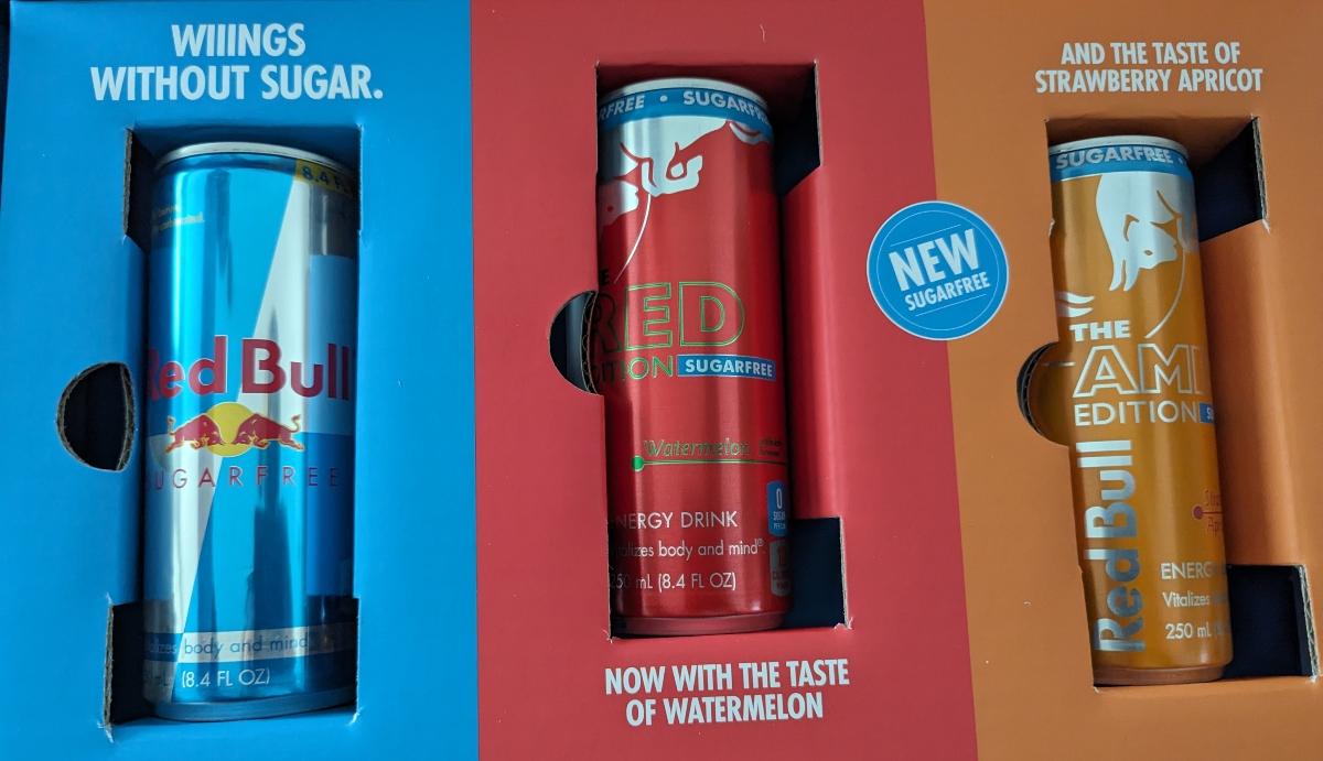 Three cans of sugar free Red Bull in a box