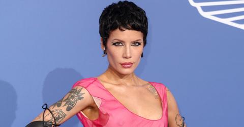 Halsey attends the 2023 amfAR Cannes Gala in a pink dress.