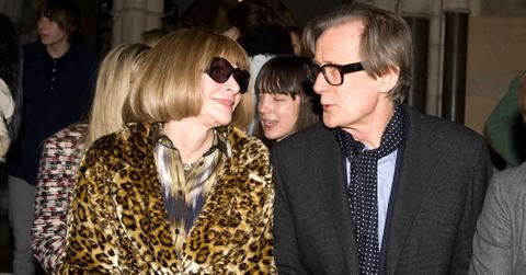 (l-r): Anna Wintour smiling at Bill Nighy