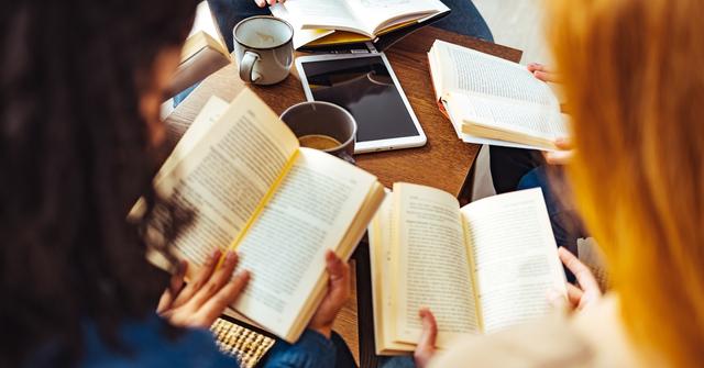 Group of three women with books and coffee