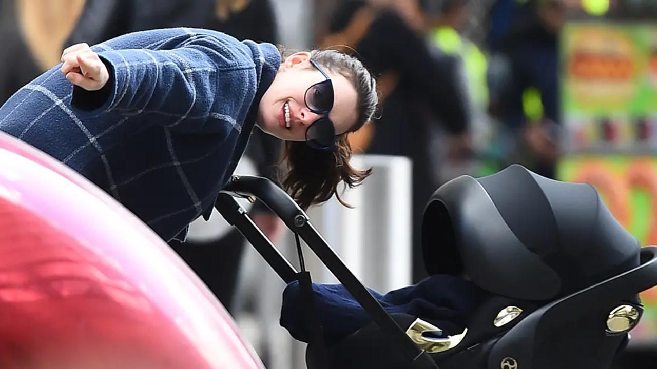 Anne Hathaway pushing her son in a stroller in 2016