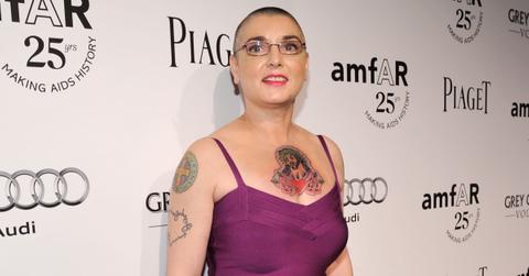 Singer Sinéad O'Connor wears a strappy pink dress and glasses, attends the The 2011 amfAR Inspiration Gala held at the Chateau Marmont on October 27, 2011 in Los Angeles, California.