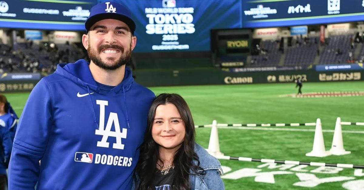 Alex Vesia and his wife on a baseball diamond in Tokyo.