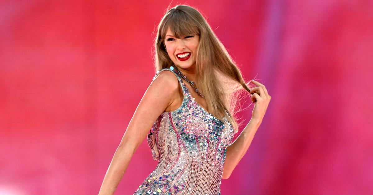 Taylor Swift smiles while performing on stage during the "Taylor Swift: The Eras Tour" at Wembley Stadium on Aug. 15, 2024, in London.