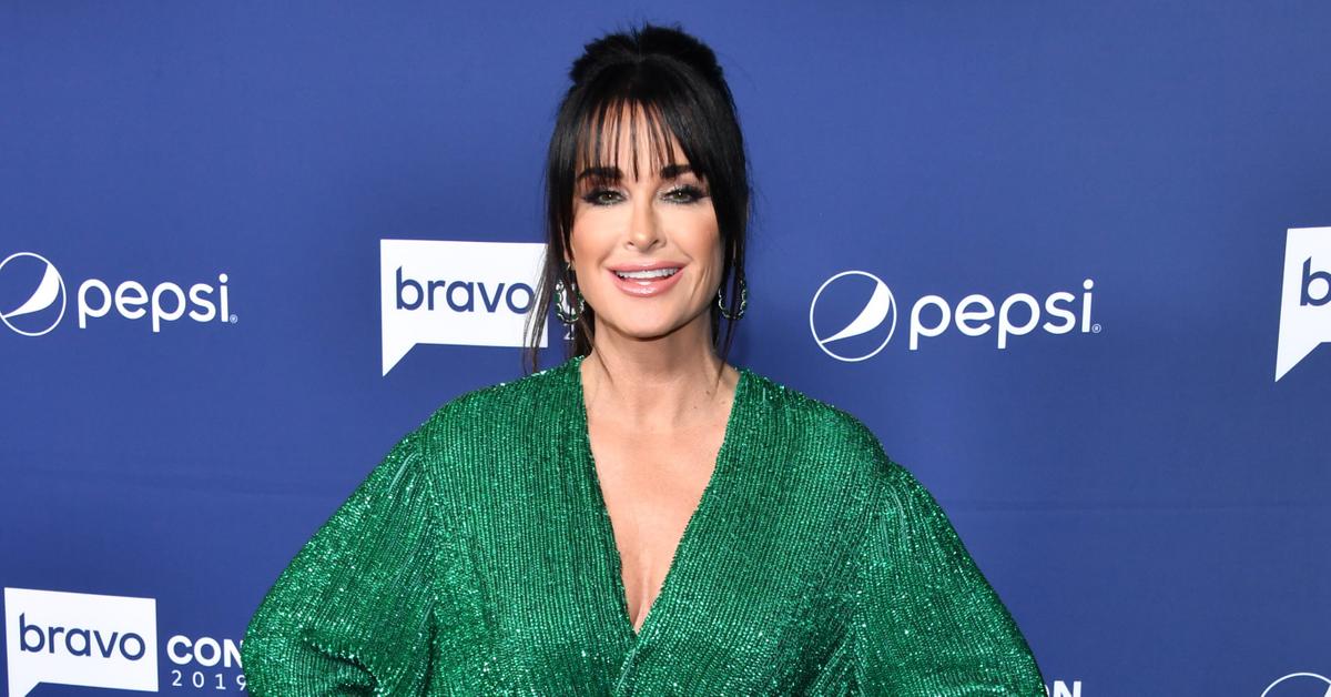 Kyle Richards plugs her own retail store by leaving her boutique with bags  full of purchases in LA