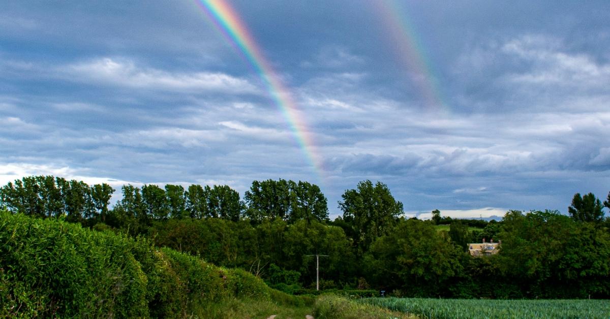 A double rainbow spotted in a rural area.