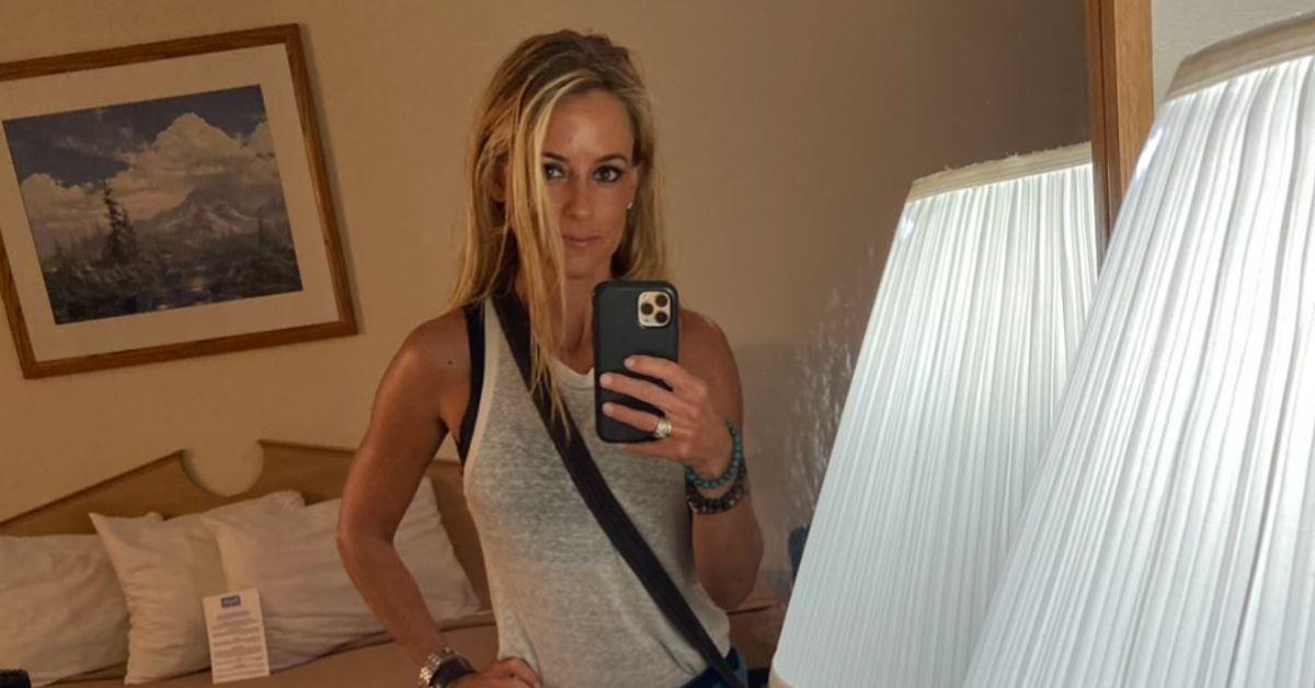 Nicole Curtis taking a mirror selfie in a tank top. 