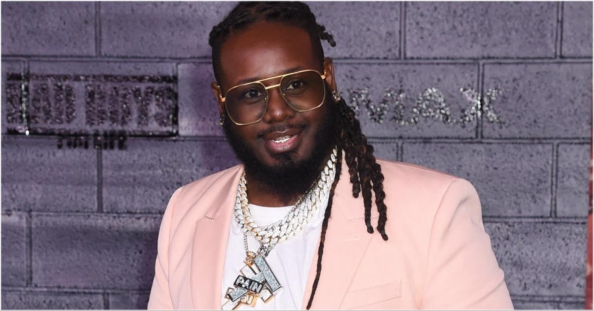 press photo of t pain in a pink suit