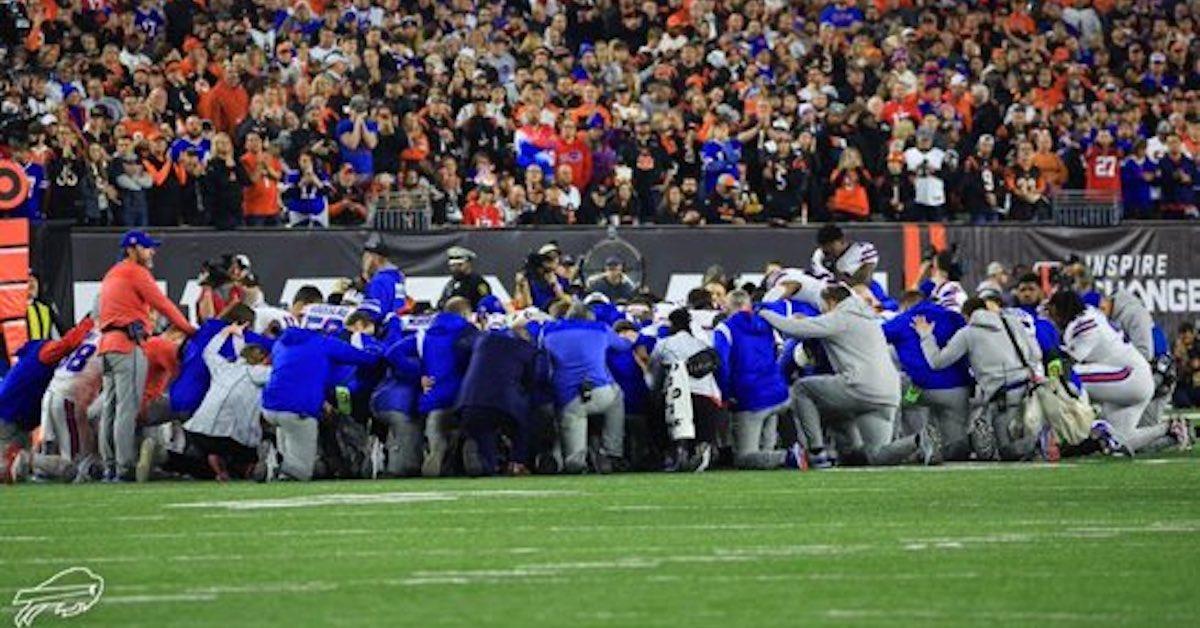 Buffalo Bills players and staff on the field after Damar Hamlin's collapse