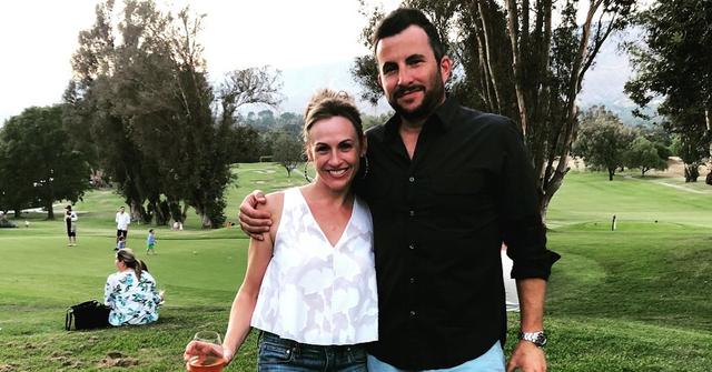 Zach Goldsmith and his wife Jennifer Hamilton-Goldsmith at a park