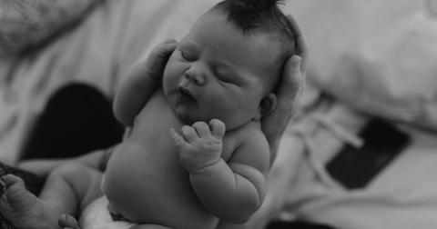 Hilary Duff holding her fourth child, Townes, born on May 3, 2024