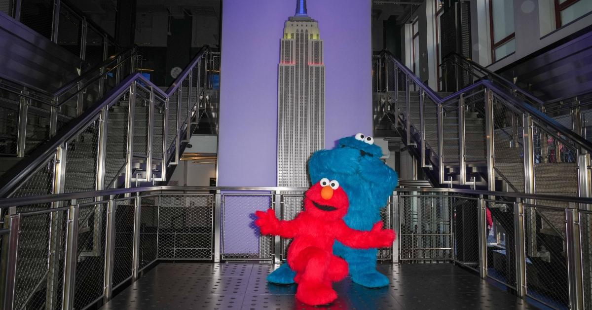 Elmo and Cookie Monster visit the Empire State Building in NYC