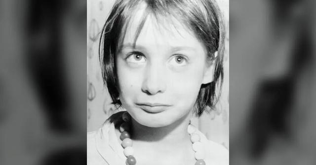 Genie Wiley wearing a bead necklace