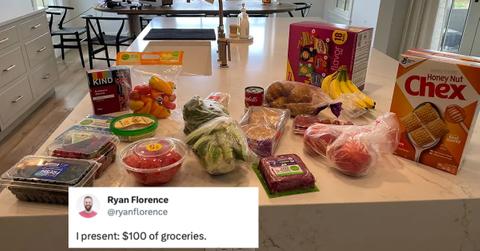 man spends 100 dollars on groceries