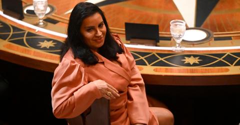 MJ participating in a Round Table during Season 2 of 'The Traitors' while sporting a pink suit.