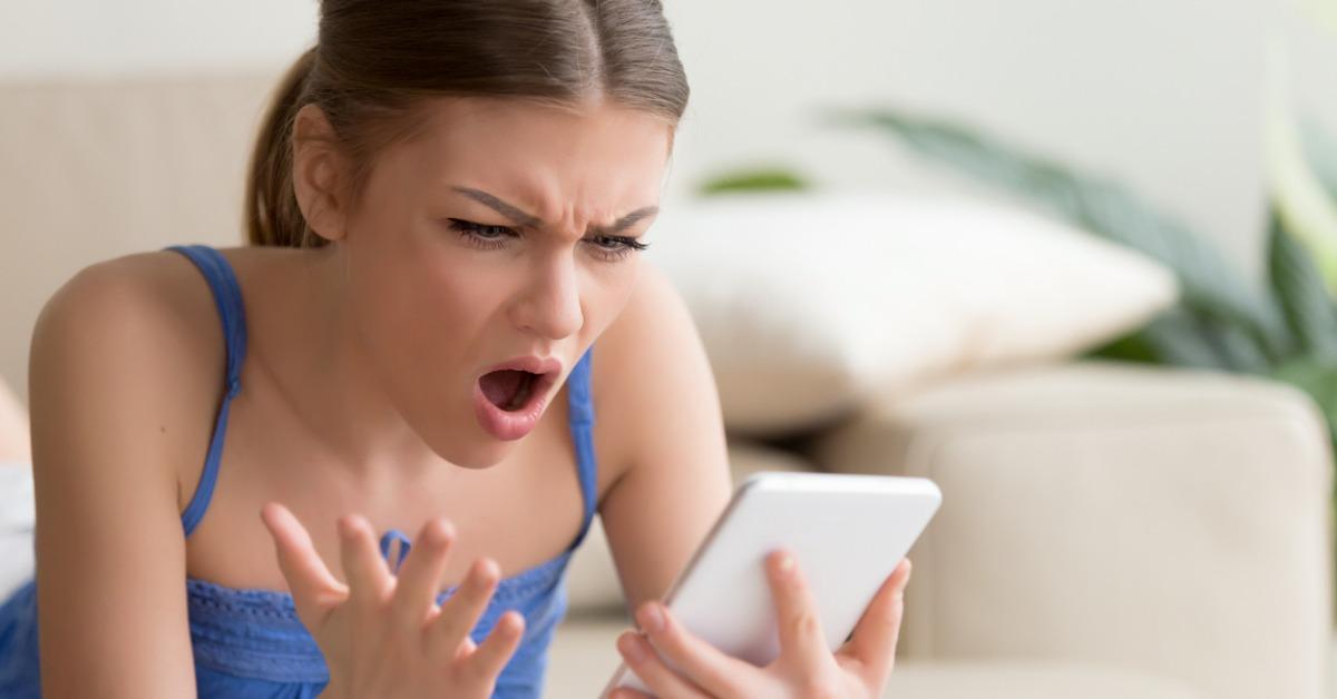 shocked young woman using digital tablet at home picture id